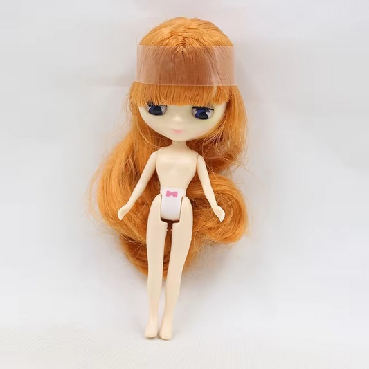 Orange hair Blythe doll with open/close eyes, flexible body, and long hair, standing on a white background.