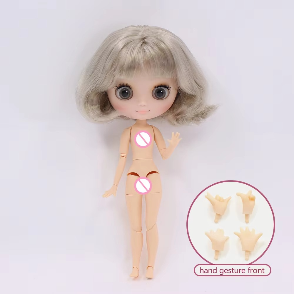 Middie Blythe Doll with short blonde hair and jointed body, including hand gesture accessories.